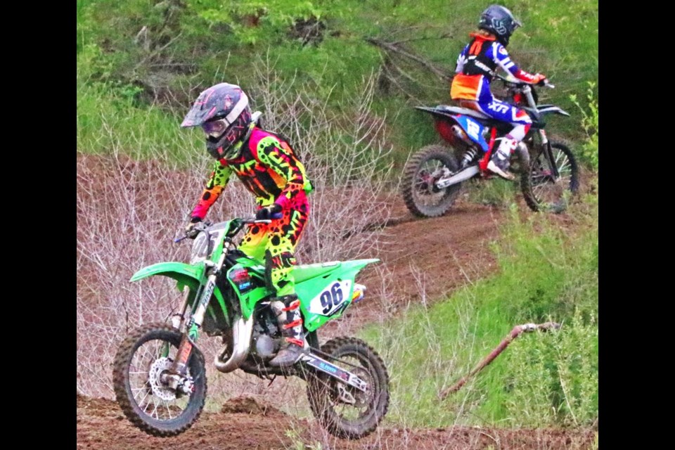 Two racers are shown at different points of the race on Sunday at Weyburn's race track.