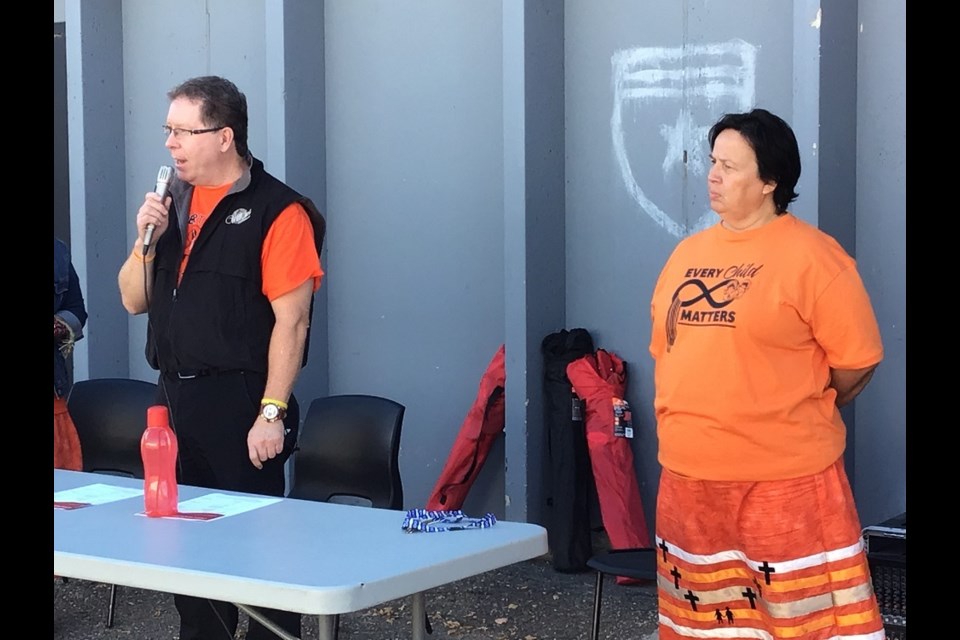 Mayor David Gillan along with Jackie Kennedy of Battlefords Indian and Metis Friendship Centre address those on hand. 