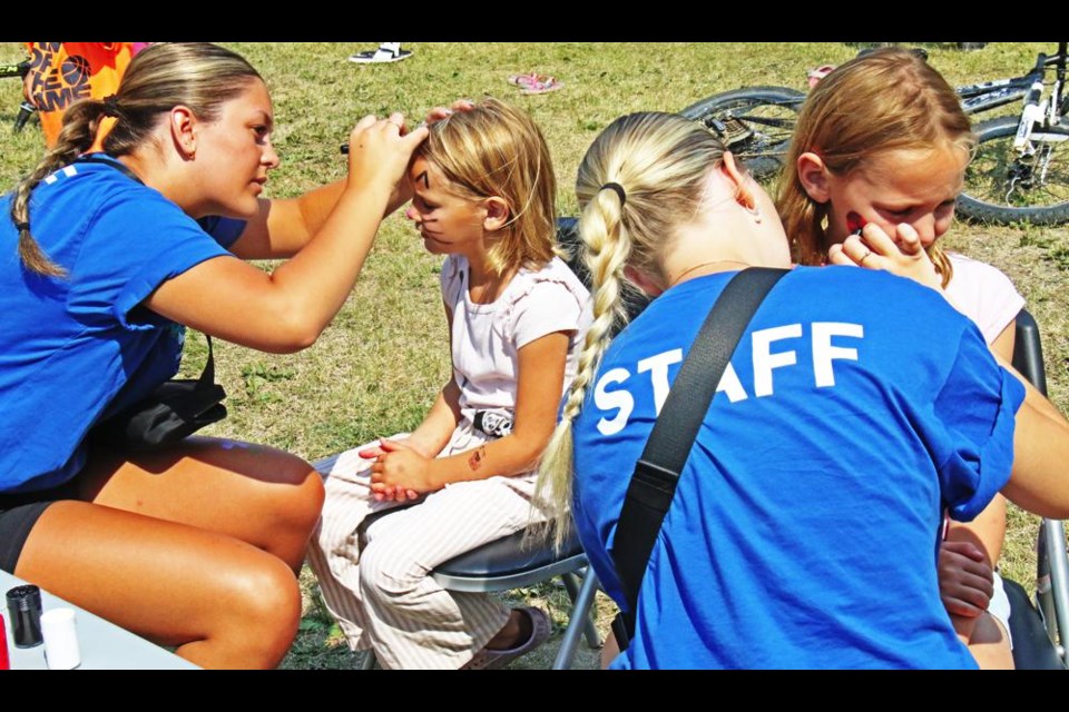 Nickle Lake staff Dayton and Lauren provided face-painting as part of Nickle Lake Day on Saturday.