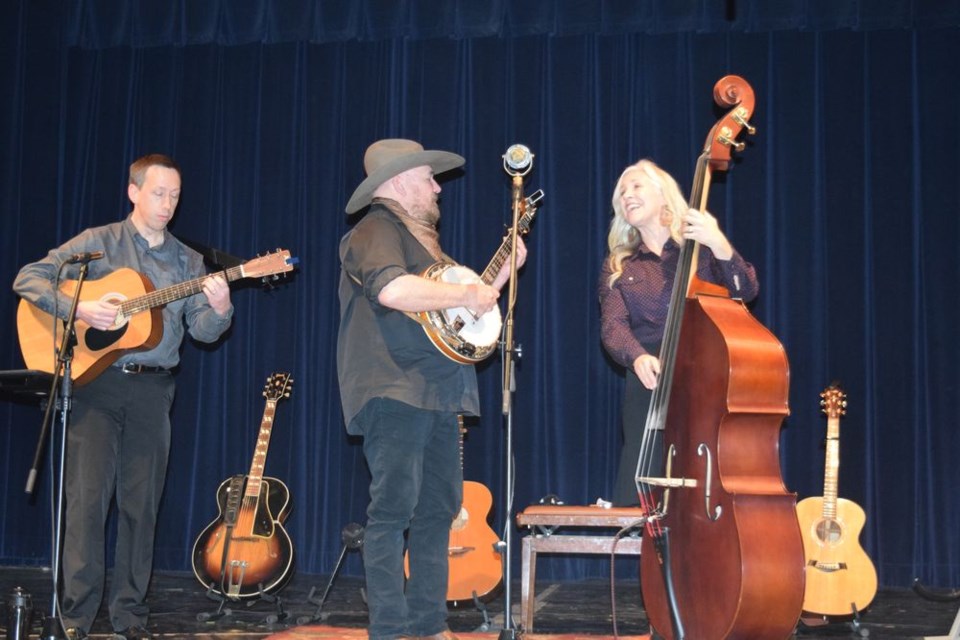 Over The Moon, the husband and wife duo of Craig Bignell and Suzanne Levesque, entertained an appreciative audience at Canora Composite School on November 16, backed by versatile musician Cedric Blary, left. / Rocky Neufeld
