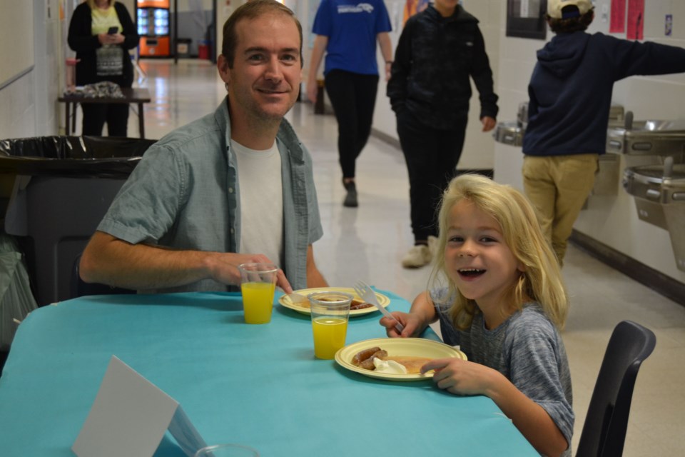 Shane Nelson and his son Oliver looked like they were thoroughly enjoying their pancakes at the Preeceville School Education Week pancake breakfast