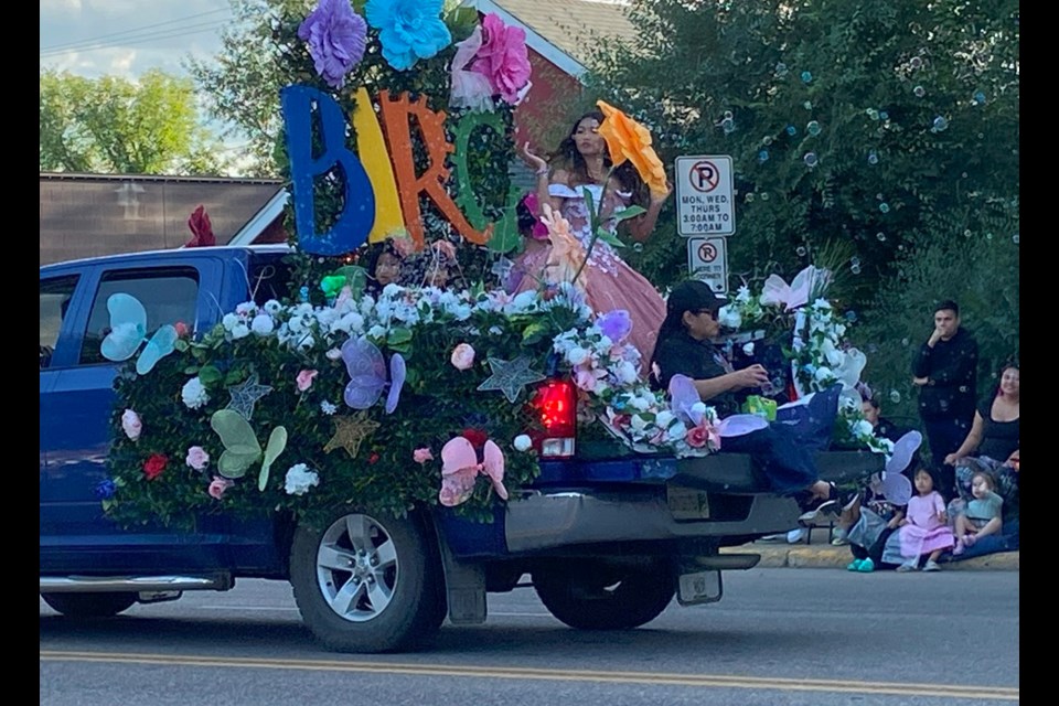 Participants on the Battlefords Immigration Resource Centre's float blow bubbles to get into the spirit during the parade.