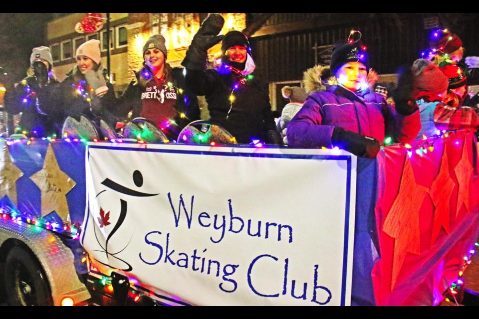 Members of the Weyburn Skating Club waved from their float in the Parade of Lights - they won the prize for the best float by an organization in the parade.