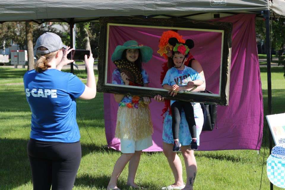 A family has their photo taken at the photo booth.