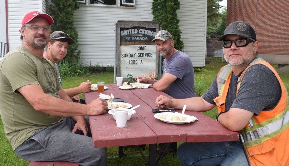 It seemed like most of Canora dropped in to satisfy their hunger at the Perogy Lunch hosted by the St. Andrews United Church on July 19. Among those with big appetites, from left, were: Corey Heshka, Robert Taylor, Darcy Rewakowsky and Eric Boychuk.