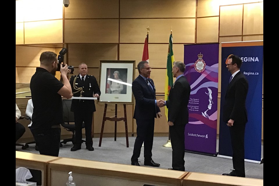 Seen here, Lt. Governor Mirasty presents the Platinum Jubilee medal to Greg Schwartz, one of the 164 Regina recipients honoured.