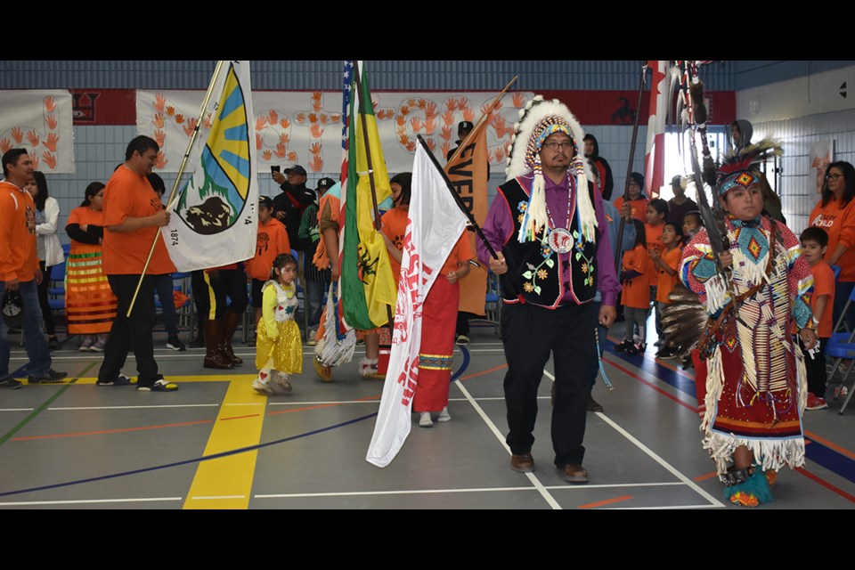 Chief Lee Kitchemonia of Keeseekoose First Nation and Treaune Severight led the grand entry at the mini powwow held in recognition of the National Day of Truth and Reconciliation (Sept. 30) at Keeseekoose Chiefs Education Centre on Sept. 29.
