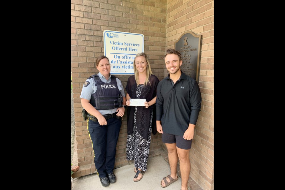 From left, RCMP Sgt. Tasha Reid, Nicole Gervais with 鶹ýAVeast Regional Victim Services and Const. Brandon Glasser with the RCMP participate in a recent cheque presentation. The money was raised during a recent golf tournament to benefit Victim Services