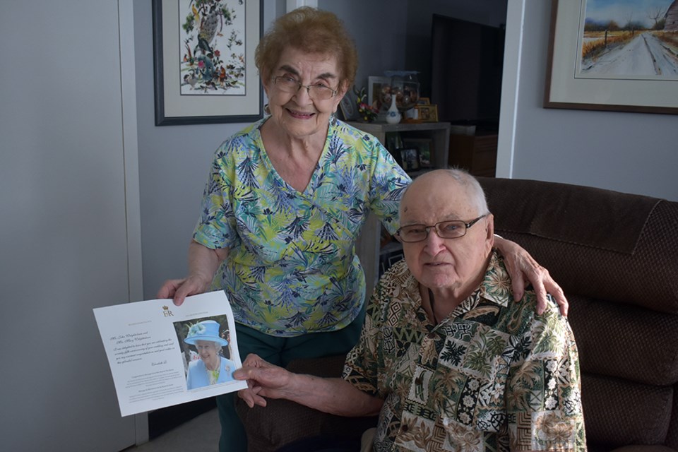 Among prized possessions of Mary and John Welykholowa, who had been among members of the Kamsack branch of the Royal Canadian Legion to welcome Queen Elizabeth II and Prince Philip to Kamsack, is this card the couple received from Buckingham Palace last year congratulating them on their 75th wedding anniversary. 