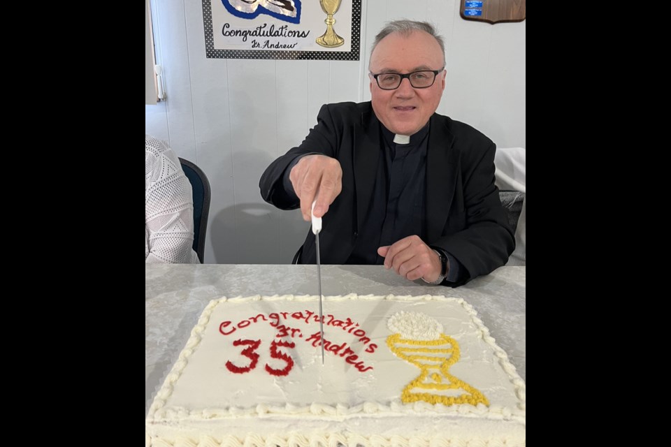 Father Andrew Sowa, O.M.I. cut the cake when St. Anthony's Parish of Rama hosted a celebration of the 35th anniversary of his priestly ordination.