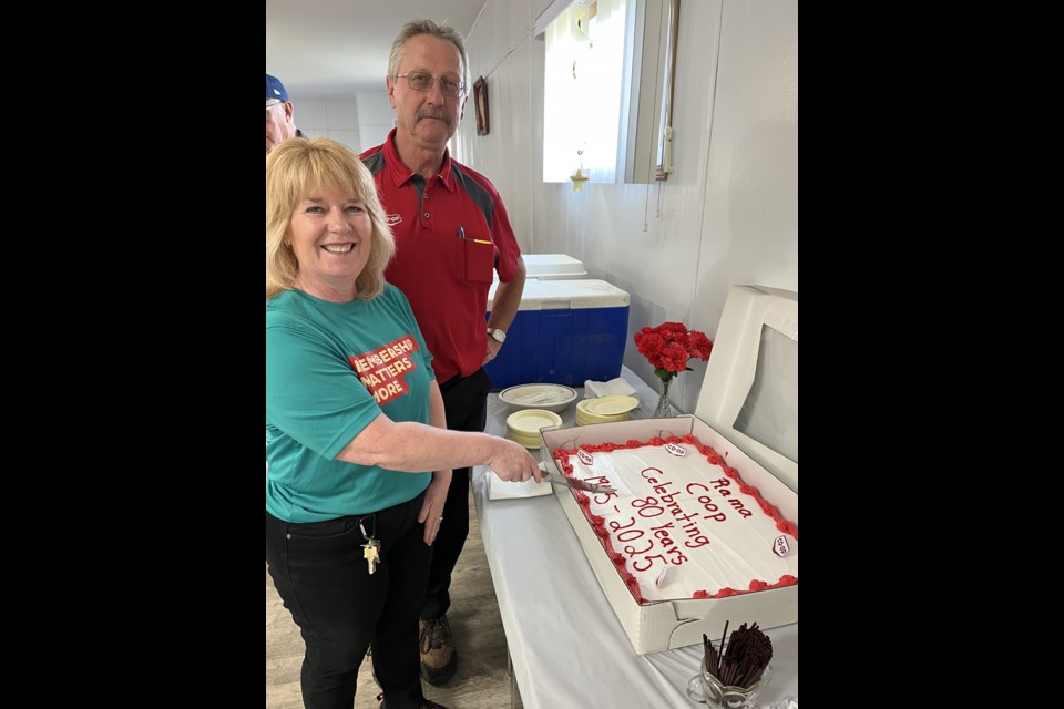 Cutting the cake for the Rama Co-op 80th anniversary celebration on July 29 were Glenda Jeffrey, Agro Manager and Daryl Michaluk, General Manager.