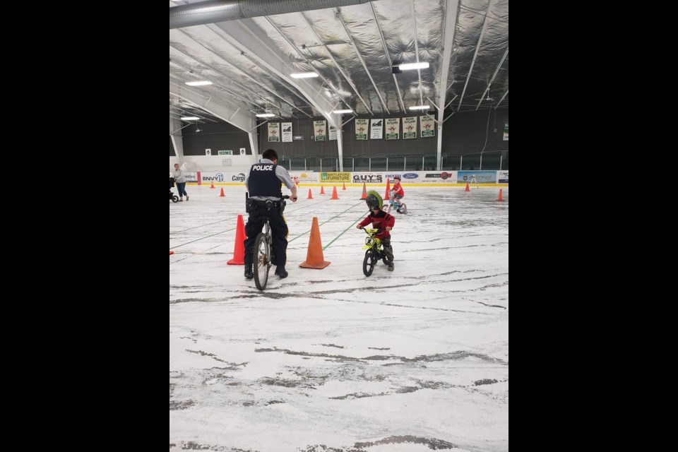 Cst. Rompre and Levi get ready to run the course at Wilkie's Bike Rodeo event May 17.