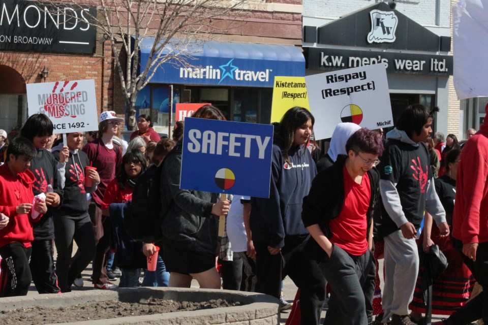 Hundreds gathered for the Red Dress Day Memorial Honour Walk that started at Yorkton Tribal Council on King Street and saw the crowd progress down 7th Avenue to Broadway, and over to City Centre Park.