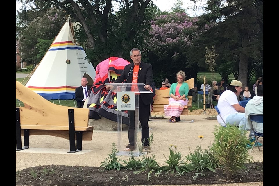 Scenes from the unveiling of the provincial residential schools memorial. Lt.-Gov. Russ Mirasty is seen speaking.