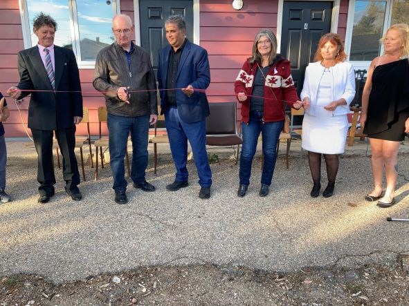 Mayor David Ziegler was tasked with the ribbon cutting at the grand opening of the Wilkie Motel.