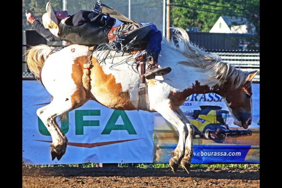 Cassien Haudegaud of Yellow Grass was the first to ride in the bareback bronc event at the Souris River Rodeo, held as part of the Weyburn Fair on Friday evening.