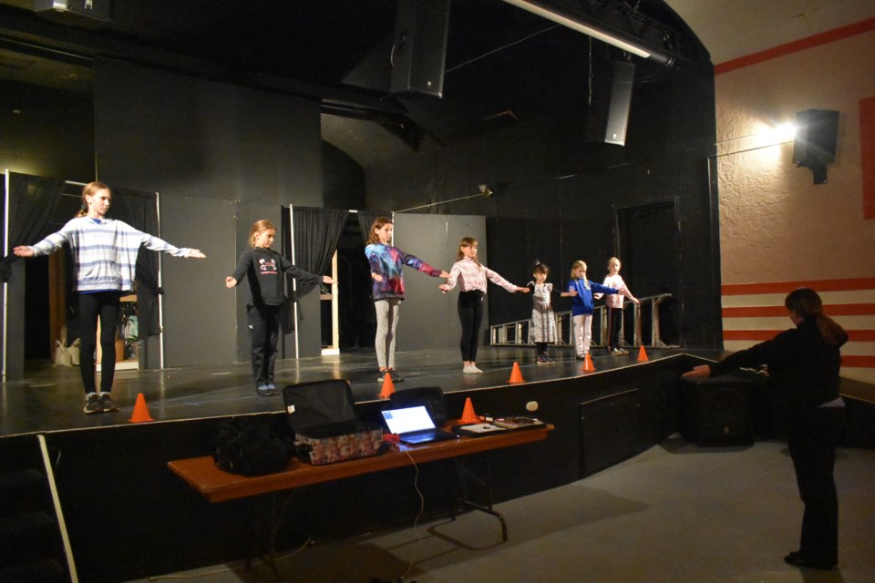 Anna Lee Parnetta, far right, taught the open-house dancers, some new and some old, how to practice the various poses in Ukrainian Dance.