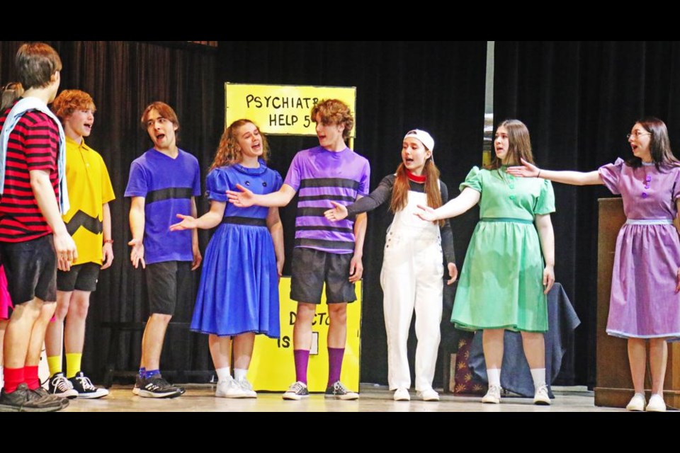 The Spirit Singers cast sings the title song, "You're A Good Man, Charlie Brown" while pointing at Charlie Brown (played by Donald Alexander), in a performance by the Spirit Singers on Tuesday at the Mayor's Luncheon.