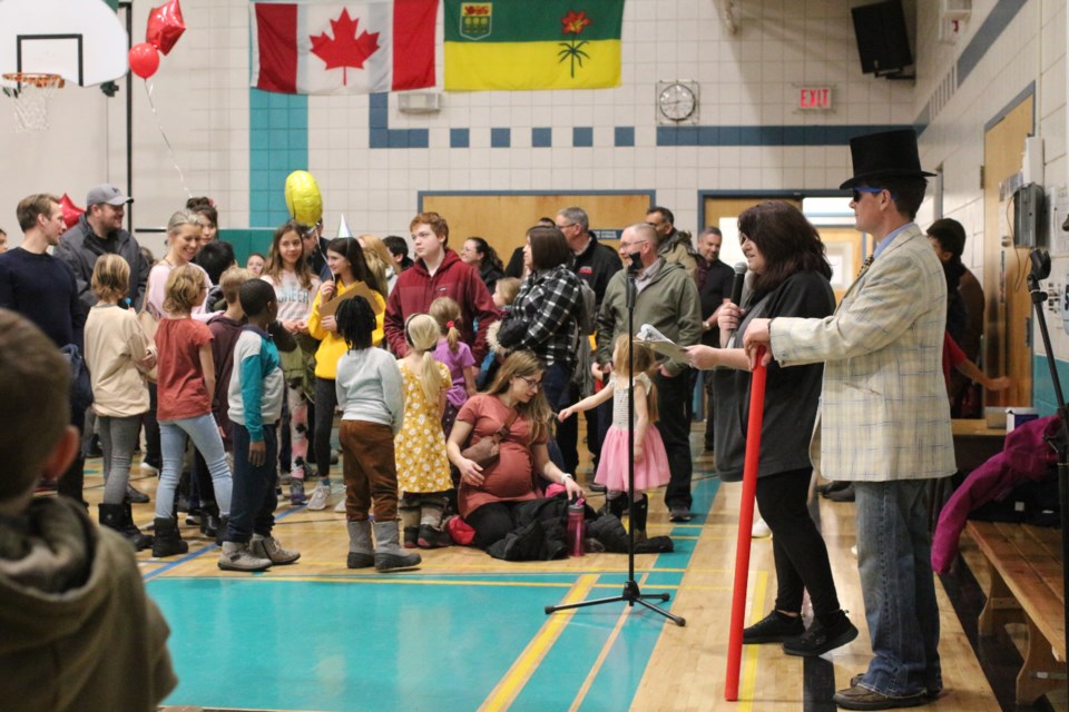 Tammi Latimer, pictured here with Mr. Lemoncello, speaks to the school prior to the start of the events.