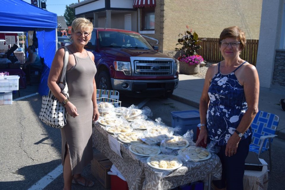 Virginia (Hyrwkiw) Wildeman, left, was up early for the Live & Play Street Festival on Aug. 21 to check out Irene Skurat’s popular assortment of homemade perahee, including: cheese, potato, bean, apple, raspberry, saskatoon, rhubarb, strawberry and cranberry.