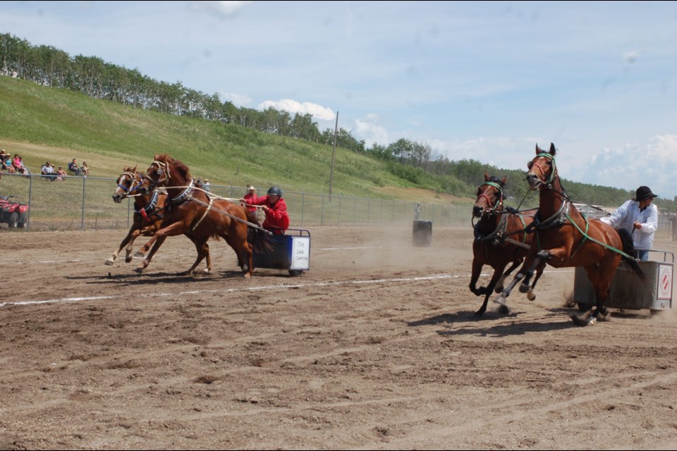 Kelvin Young, right, challenged Calvin Longman for top spot in one of the chariot race heats at the Sturgis Sports and Rodeo.


