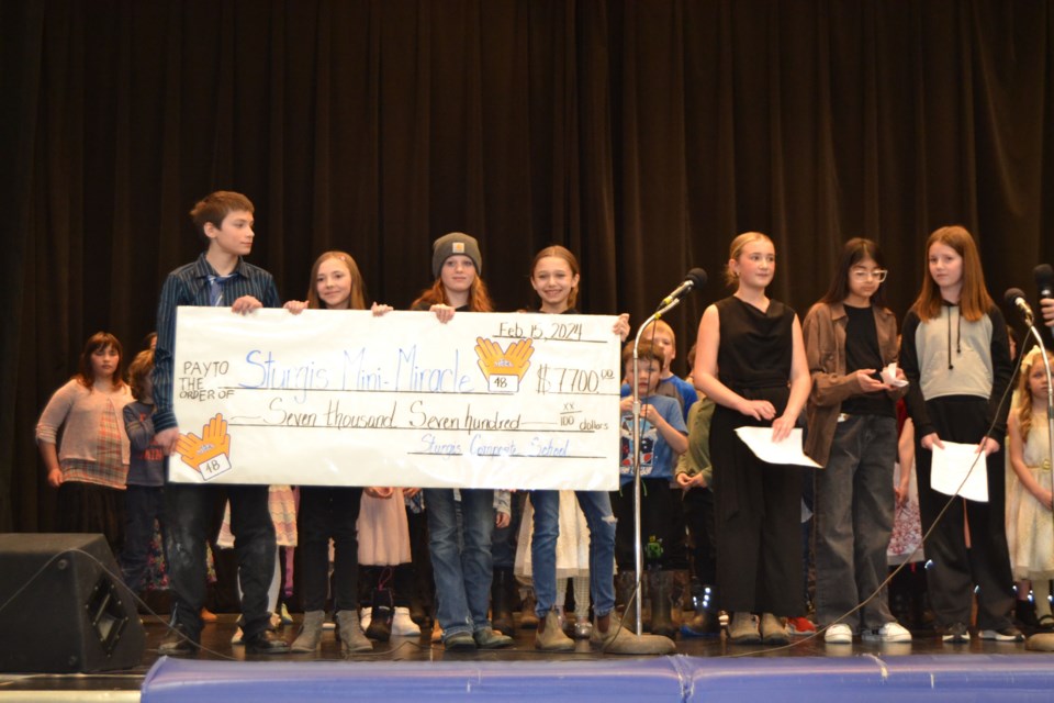 Sturgis Composite School made a presentation of $7,700 towards TeleMiracle at the Sturgis Kin Club Mini-Miracle. Students making the presentation from left, were: Jayden Poworoznyk-Bates, Avery Mitchell, Jade Beatty, Lily Beatty, Eva Romanchuk, Skye Houghton and Gemma Rudachyk.