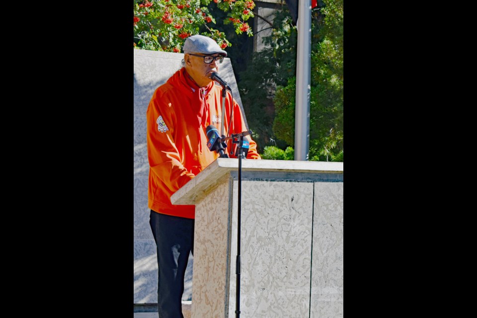 Eugene Arcand delivers his opening remarks before the raising of the Survivors' Flag.