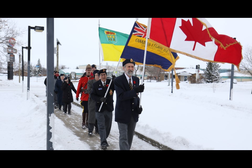 The colour party marches to the cenotaph at Tisdale's Memorial Park for the Remembrance Day СƵ.