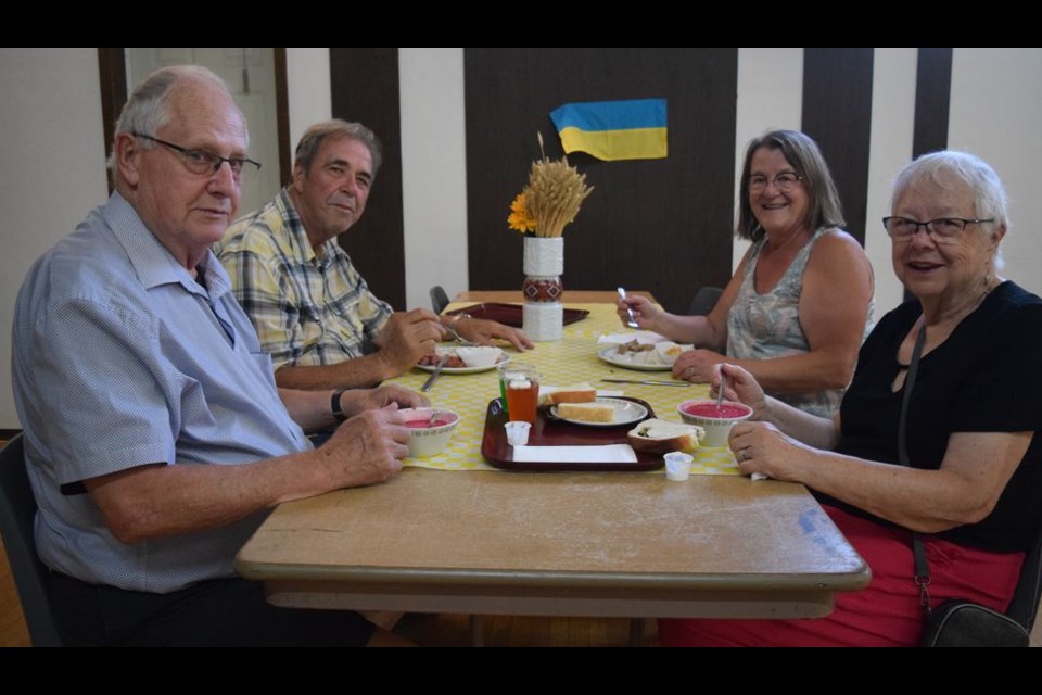 With the Russian invasion of Ukraine on the minds of many, Touch of Ukraine at Canora’s Rainbow Hall was a popular destination on Aug. 20 during the Live & Play Street Festival.  From left, were: George Pretli, Ivan and Sonia Kostyshyn, and Marg Pretli. The Pretli’s now live in Spiritwood, but are originally from Canora.