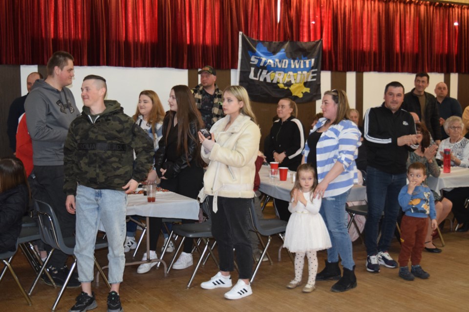Ukrainian newcomers to Canora and the surrounding area were asked to stand. They were then met with applause at a special event held for them at Rainbow Hall in Canora on April 22.
