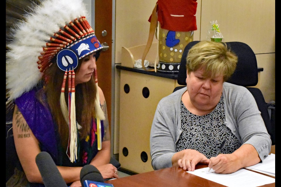 Cameco chair in Indigenous Health and Wellness at the University of Saskatchewan Dr. Alexandra King, right, looks on as Federation of Sovereign Indigenous Nations Third Vice-Chief Aly Bear signs the memorandum of understanding on Friday, June 24, at USask's Health Sciences building.
