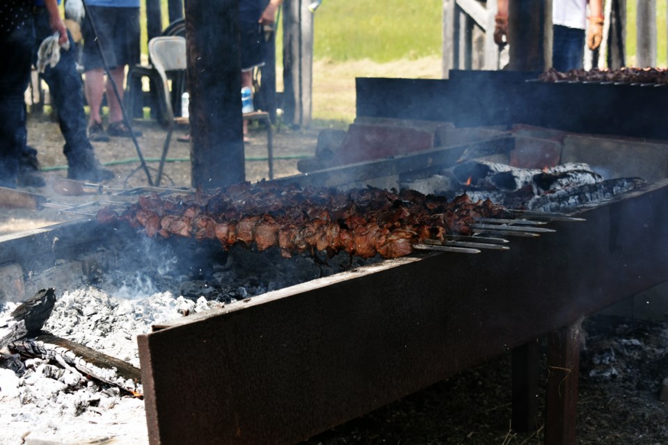 Expecting the large attendance, the Veregin Recreation Board ensured the shishliki was barbecued in large quantities.
