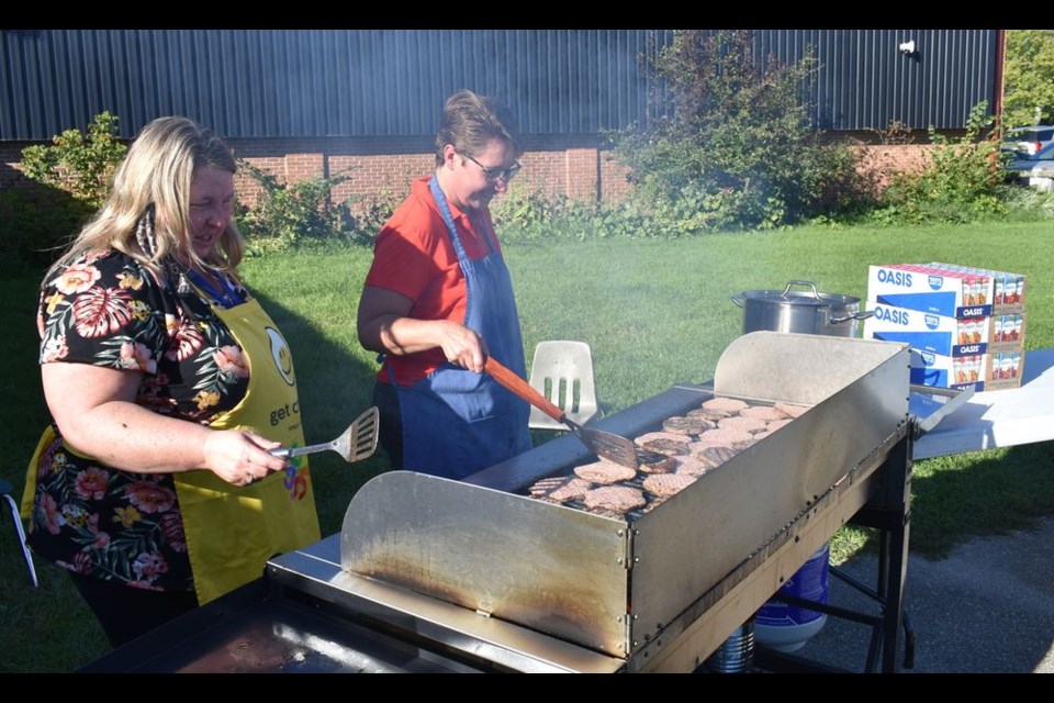 Mrs. Hudye, left, and Ms. Fissel showed off their impressive grilling skills at the Victoria School Family Barbecue on Wednesday, September 8.