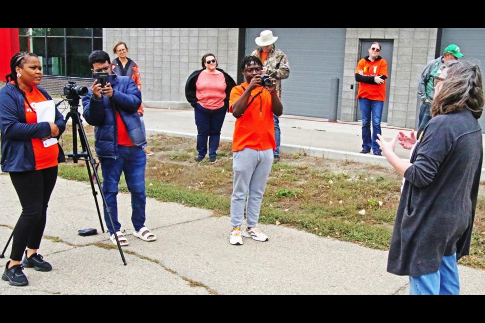 Weyburn Arts Council curator Regan Lanning, at right, did an interview for a video by Sask Culture just prior to the Walk for Reconciliation on Saturday afternoon at Jubilee Park.