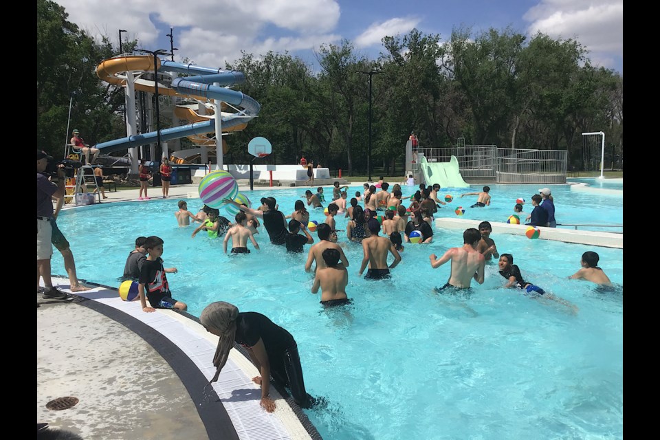 Students from Arcola Community School rushed in to the new Wascana Pool once the ribbon was cut.