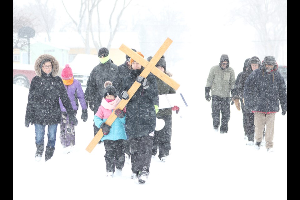 Despite a winter storm that choked the roads with snow, the St. Joseph Roman Catholic Church hosted its second annual Way of the Cross Walk on Good Friday to commemorate Jesus’ last day as a man.