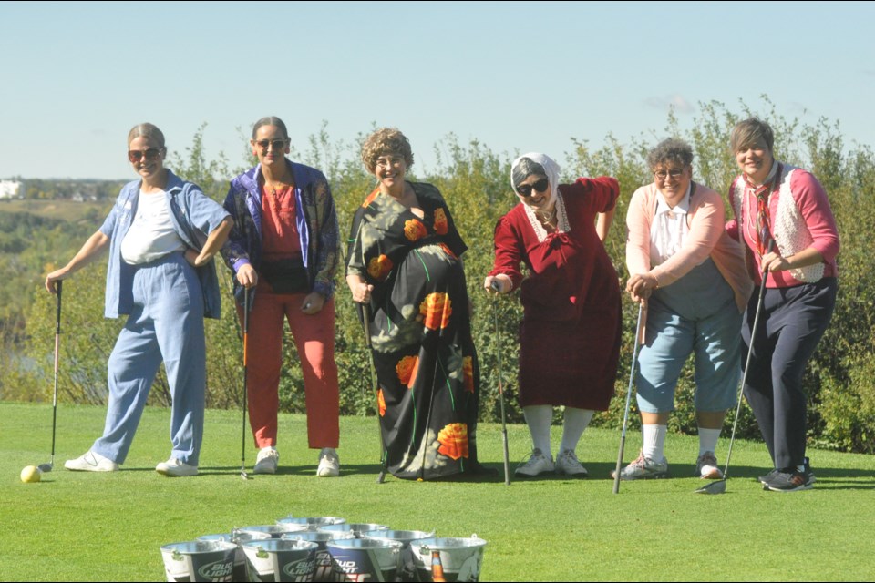 Seen here on the green are members of the Too Much Muscle team, who won the “Best Dressed” Award at the Wayne Pruden Memorial Golf Tournament: Tracy Voigt, Lori Pruden, Carmen Koehl, Donnica Bernier, Jose Pruden, and Jes Kohut. 