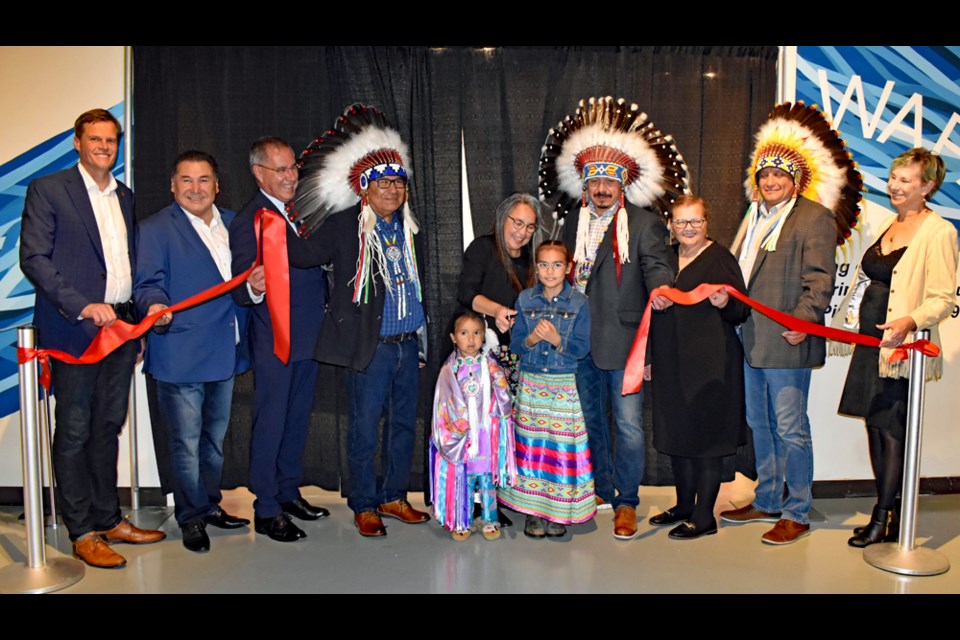 Four-year-old Ophelia Deschambeault, fifth left, and Dallas Lafond, seventh left, join the ribbon-cutting ceremony of the exhibit at the Western Development Museum. Others in photo, from left, are Saskatoon Mayor Charlie Clark, Whitecap Dakota First Nation Councillor Dwayne Eagle, Saskatchewan Lt.-Gov. Russell Mirasty, WDFN Councillor Frank Royal, WDFN Chief Darcy Bear, Saskatchewan Minister of Parks, Culture and Sports Laura Ross, Saskatoon Tribal Council Chief Mark Arcand and WDM board chair Orlanda Drebit.