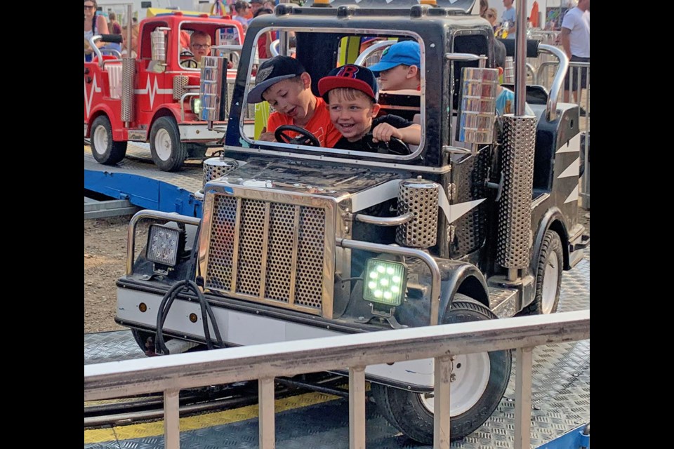 The 116th Annual Weyburn Fair Days ran from July 3-5. These two boys enjoy "driving" the little Jeep during the fair on Saturday. 