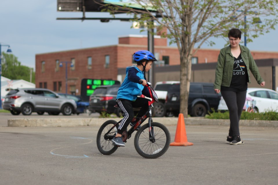 Youth practiced proper cycling techniques at the bike rodeo.