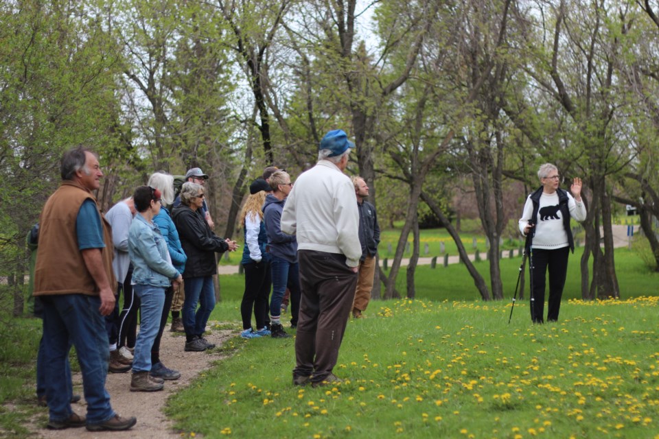 One of the organizers of the event, Carol Bolt, gives attendees a brief history lesson during the walk.