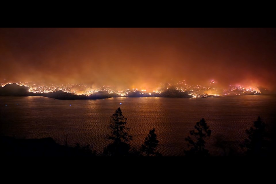 This photo was taken from the base of the hill, where Kim Barnstable's house is located in Kelowna, looking across the lake at the fire on the west side at night on Aug. 17. This was taken just before the fire jumped across the lake to the Kelowna side. 