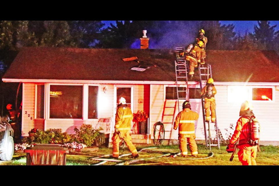 Weyburn fire fighters were busy on a number of fronts fighting a fire in this home on Douglas Road on Friday evening, across the road from Elks Park.