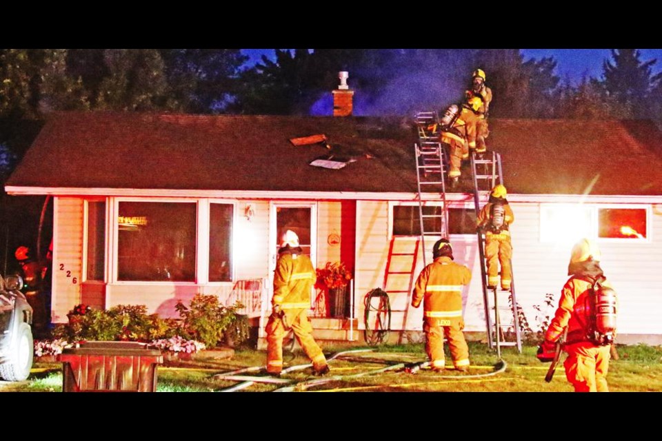 Weyburn fire fighters were busy on a number of fronts fighting a fire in this home on Douglas Road on Friday evening, across the road from Elks Park.
