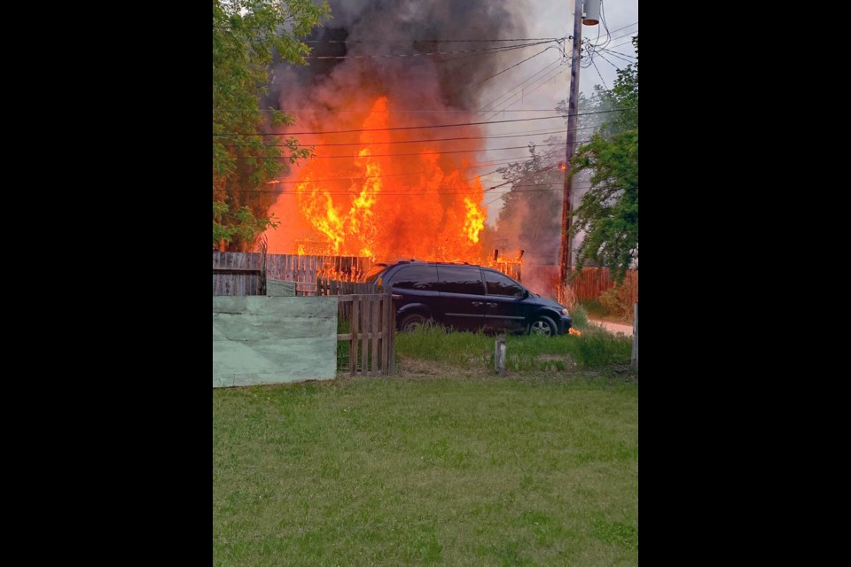 A fire reached a parked minivan near the garage on the 1200 block of Avenue G North.