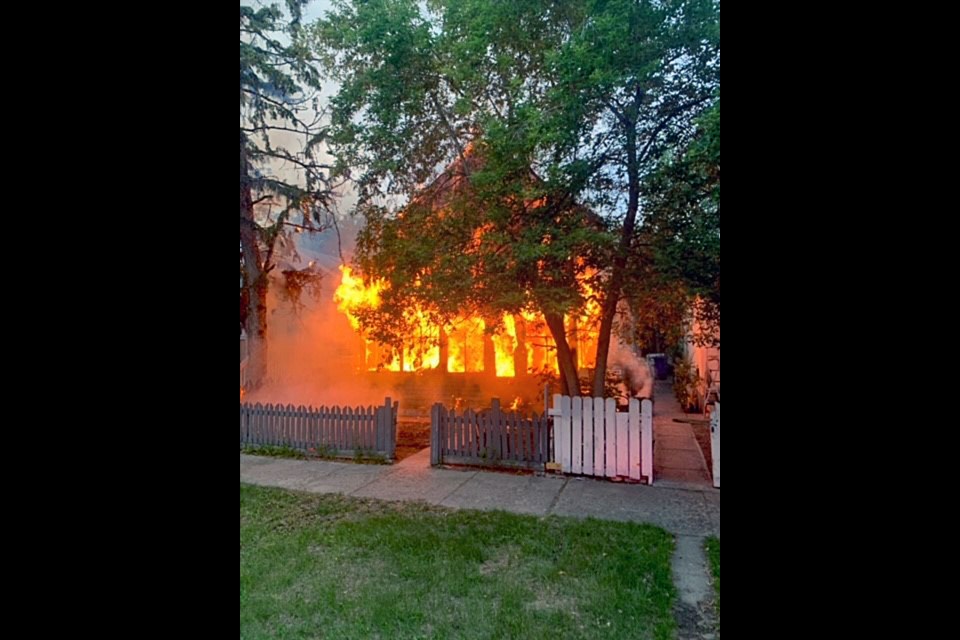 Flames fully engulf the structure in the 300 block of Avenue J South.