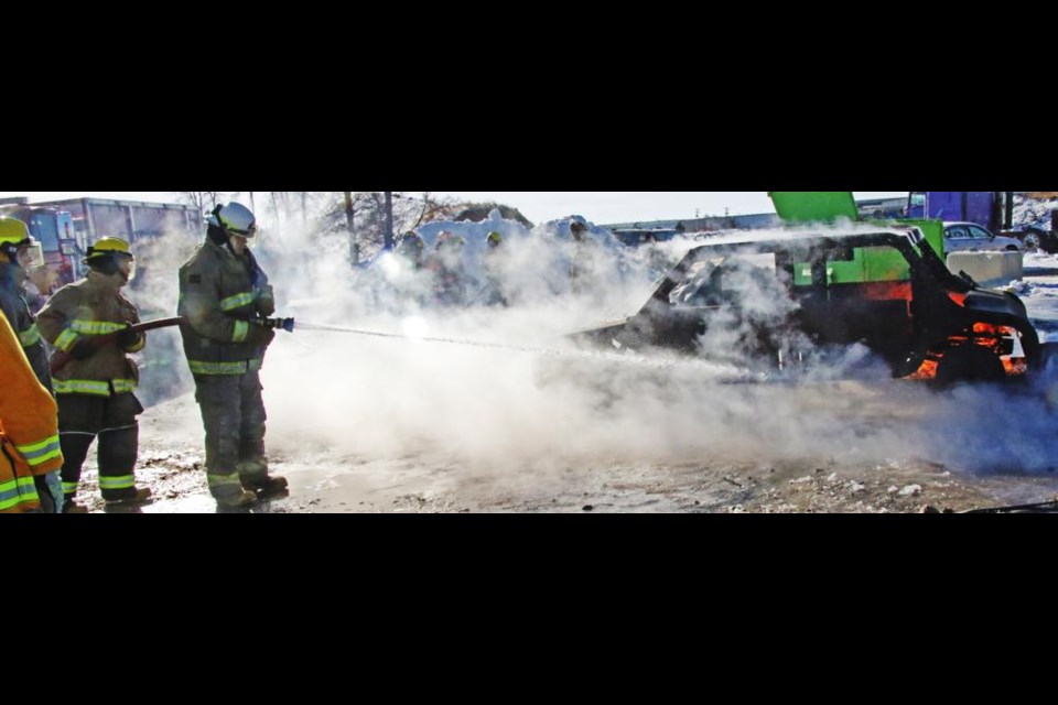 Fire fighters practiced suppressing a vehicle fire at the training session hosted by the Weyburn Fire Dept.