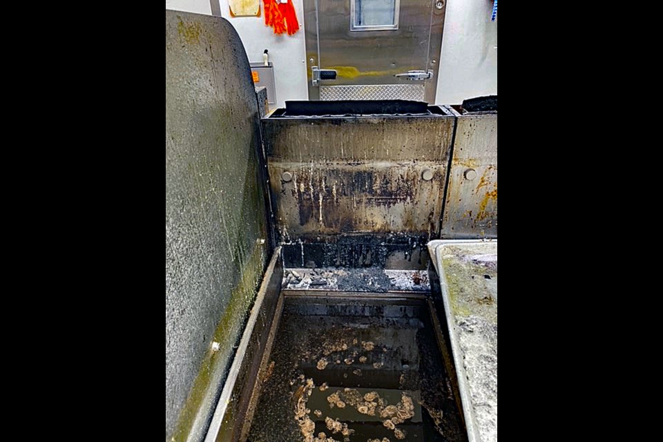 A Class K fire extinguisher was used to put out the grease fire.