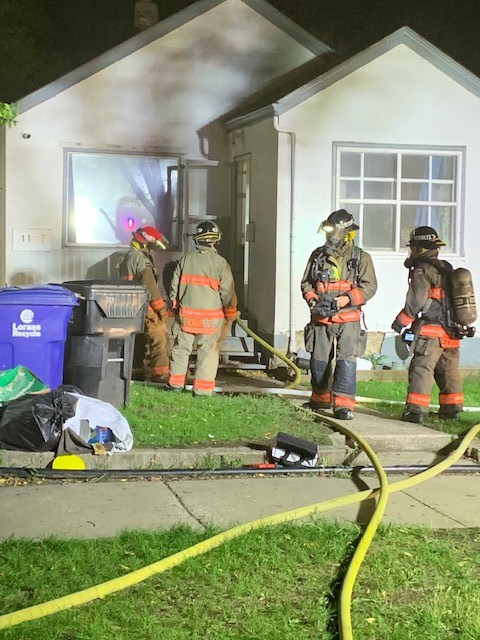 Fire crews check the structure to see if the fire at the 1100 block of Avenue G South is controlled.