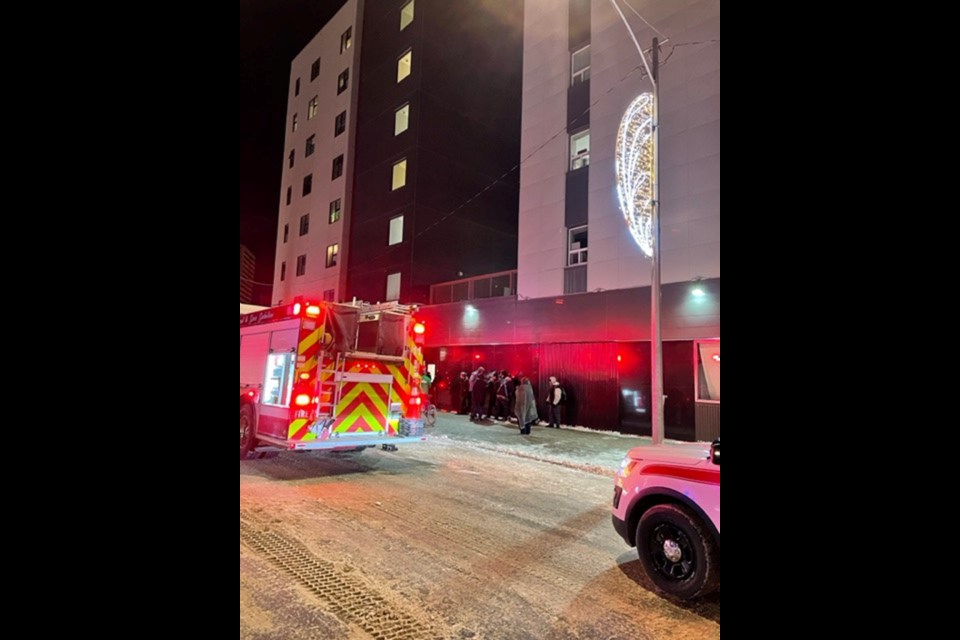 Fire crews assist in making sure the fire in the third level of The Lighthouse has been contained.